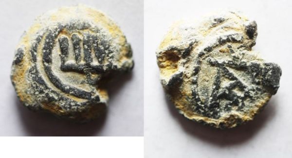 Picture of Byzantine lead bulla (18mm, 5.63g). Fifth-seventh century. Uncertain symbol/ Greek monogram.