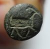 Picture of Bronze stamp seal with an ibex on its base. Iron Age II, c. 7th century BC. 