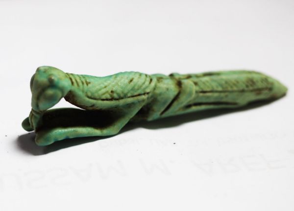 Picture of ANCIENT EGYPT. PROBABLY A UNIQUE FAIENCE AMULET OF A MANTIS. 600 - 300 B.C OR EARLIER